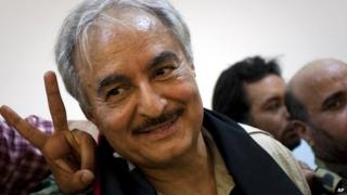 Khalifa Haftar leaves a news conference in Benghazi - 18 March 2011