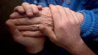 Elderly patient being cared for