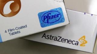 Pfizer and AstraZeneca tablet boxes