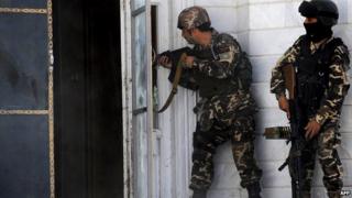 Afghan military at the scene of the attack on the Indian consulate in Herat on 23 May 2014
