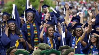 Students cheers as the class of 2014 celebrate during the graduation ceremony at Howard University in Washington 10 May 2014