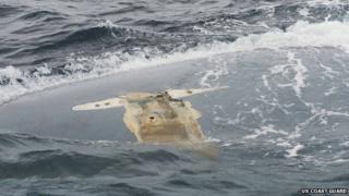 The overturned hull of the Cheeki Rafiki