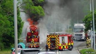 Fairground ride on fire on the A487 at griffith's Crossing in Gwynedd
