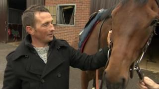 Craig Brazier patting the horse named Chatez