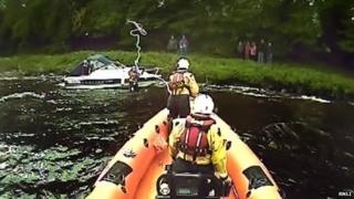 Loch Ness RNLI and grounded cruiser