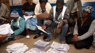 Malawian Electoral Commission workers count voted ballots on May 20, 2014 in Blantyre, Malawi
