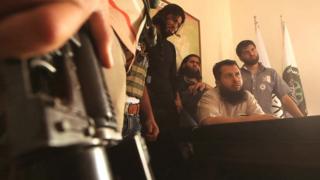Hassan Abboud (seated) and members of the Islamic Front