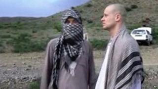 Sgt Bowe Bergdahl (right) stands with a Taliban fighter in eastern Afghanistan shortly before his release