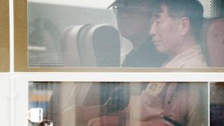 Sewol ferry captain Lee Joon-seok arrives by bus at the court in Gwangju where he will stand trial on 10 June, 2014