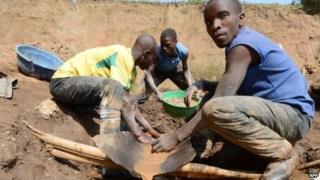 Men separate minerals from rock and sand in May 2013 near the Mudere mine, outside Rubaya, eastern Democratic Republic of Congo
