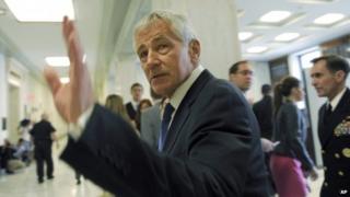 Defence Secretary Chuck Hagel arrives on Capitol Hill in Washington, 11 June 2014