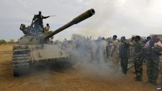 Sudanese soldiers celebrate after recapturing an area of South Kordofan from ethnic minority rebels - 20 May 2014