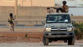 Libyan men loyal to Gen Haftar during clashes against Islamists in Benghazi - 2 June 2014