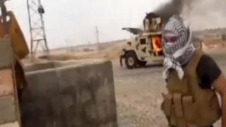 Iraqi Revolution, a group supporting the al-Qaida breakaway Islamic State of Iraq and the Levant (ISIL) on Wednesday, June 11, 2014, shows a militant in Tikrit, Iraq