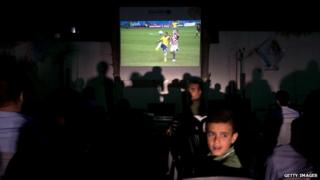 File image: Viewers watch Brazil v Croatia in Gaza City