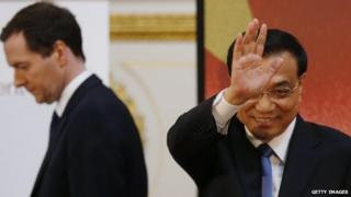 Chinese Premier Li Keqiang (right) and Britain's Chancellor of the Exchequer, George Osborne (left), at the end of his address to the delegates of the UK-China Financial Forum at Lancaster House on 18 June 2014 in London.