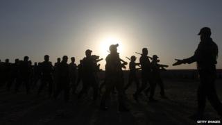 Newly-recruited Iraqi volunteers take part in a training on 19 June 2014