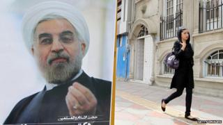 Woman in leggings passes poster of President Rouhani