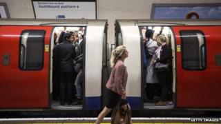 Commuters on a crowded Northern Line tube train