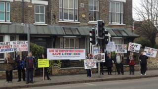Protesters outside the Tenison Road Centre