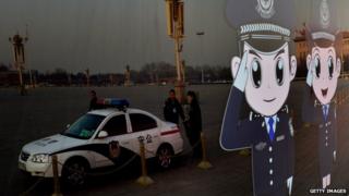 Chinese police officers reflected in bus window in Beijing