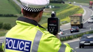 Police officer with speed gun