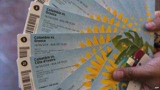 A football fan shows the tickets he bought for a World Cup match in Brazil - 18 April 2014
