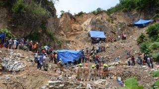 Rescue workers outside the blocked entrance to the gold mine. 04/07/2014
