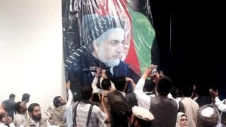 Putting up Abdullah Abdullah picture in rally