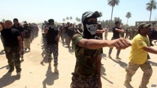 Shia militiamen volunteer to fight alongside government forces in Baghdad (9 July 2014)