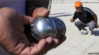 Men playing petanque