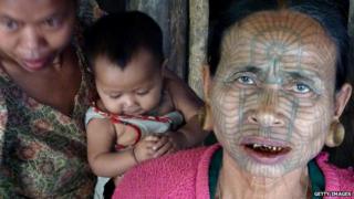 Tattooed woman in Myanmar