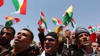 Pro-nationhood demonstrators outside the Kurdish Parliament building on 3 July, 2014.
