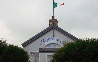 Republican and sectarian graffiti was painted on the hall and an Irish Tricolour flag was erected on the outside of the building