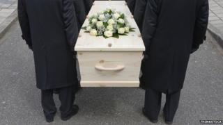 Coffin bearers carrying a coffin
