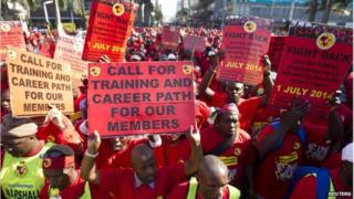 Strikers with placards