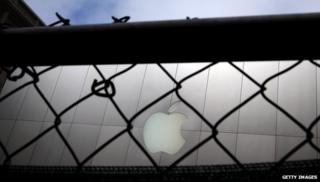 Apple logo behind fence