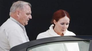 Shannon Richardson escorted to car