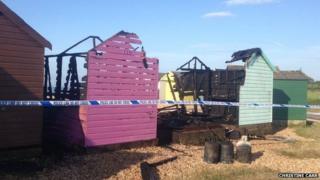 Fire damaged beach huts at Calshot