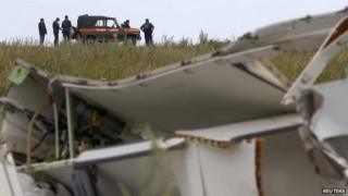 Ukrainian officials at the MH17 crash site