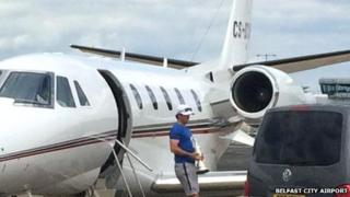 Rory McIlroy gets off plane