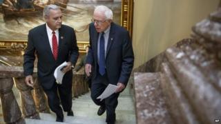 Senate Veterans’ Affairs Committee Chairman Sen. Bernie Sanders, I-Vt., right, and House Veterans’ Affairs Committee Chairman Rep. Jeff Miller, R-Florida., walk up stairs to the Senate TV studio for a news conference on Capitol Hill, 28 July 2014