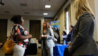 Job seekers attend a Job Expo job fair in Boston, Massachusetts