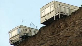 Caravans on edge of cliff