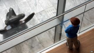 A young boy at an art gallery