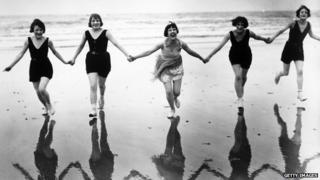 Members of the Brighton Swimming Club take advantage of an early summer to visit the beach