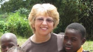 photo provided by Jeremy Writebol show his mother, Nancy Writebol, with children in Liberia 7 October 2013