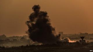 Smoke rises as a result of Israeli airstrike from the northern Gaza Strip neighborhood of Shejaeiya during sunset, 04 August