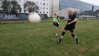 Two men playing football