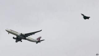 Qatar airliner being escorted by RAF